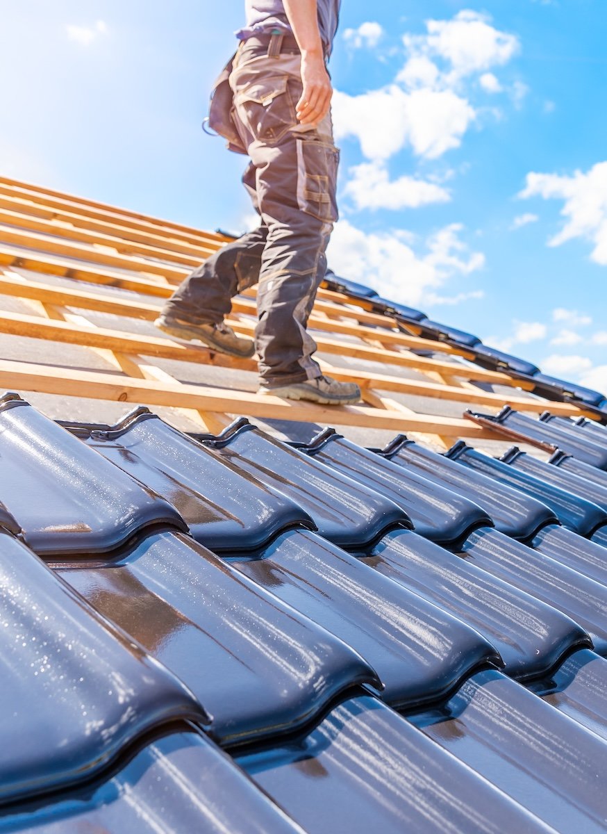man installing roof