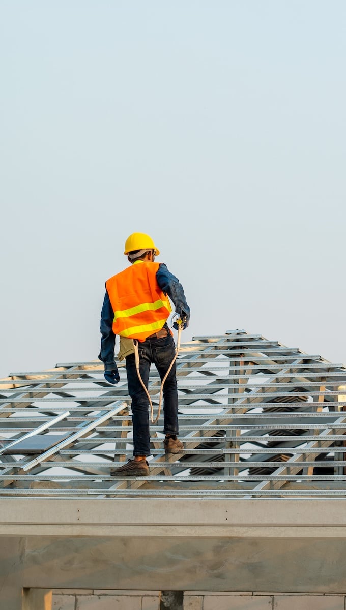 man working on roof