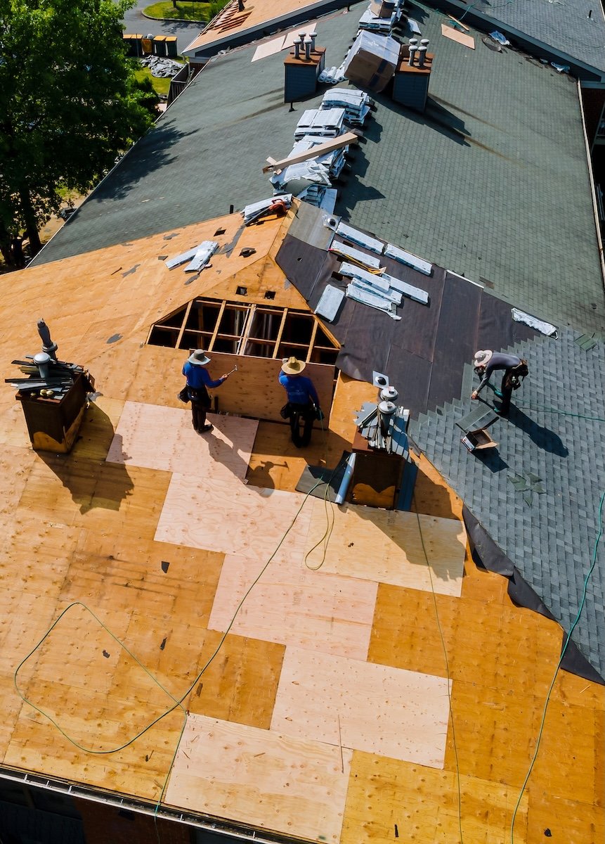men working on roof installation