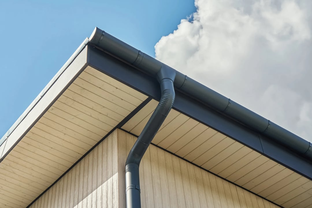 Contemporary grey metal rainwater downpipe installed