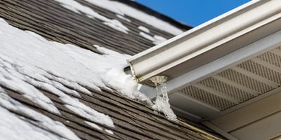 How Do Flat Commercial Roofs Drain Water and Snowmelt?